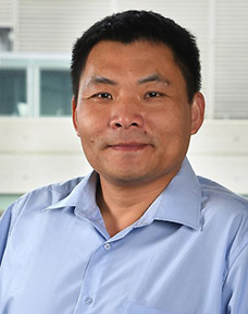 Image of man in blue shirt