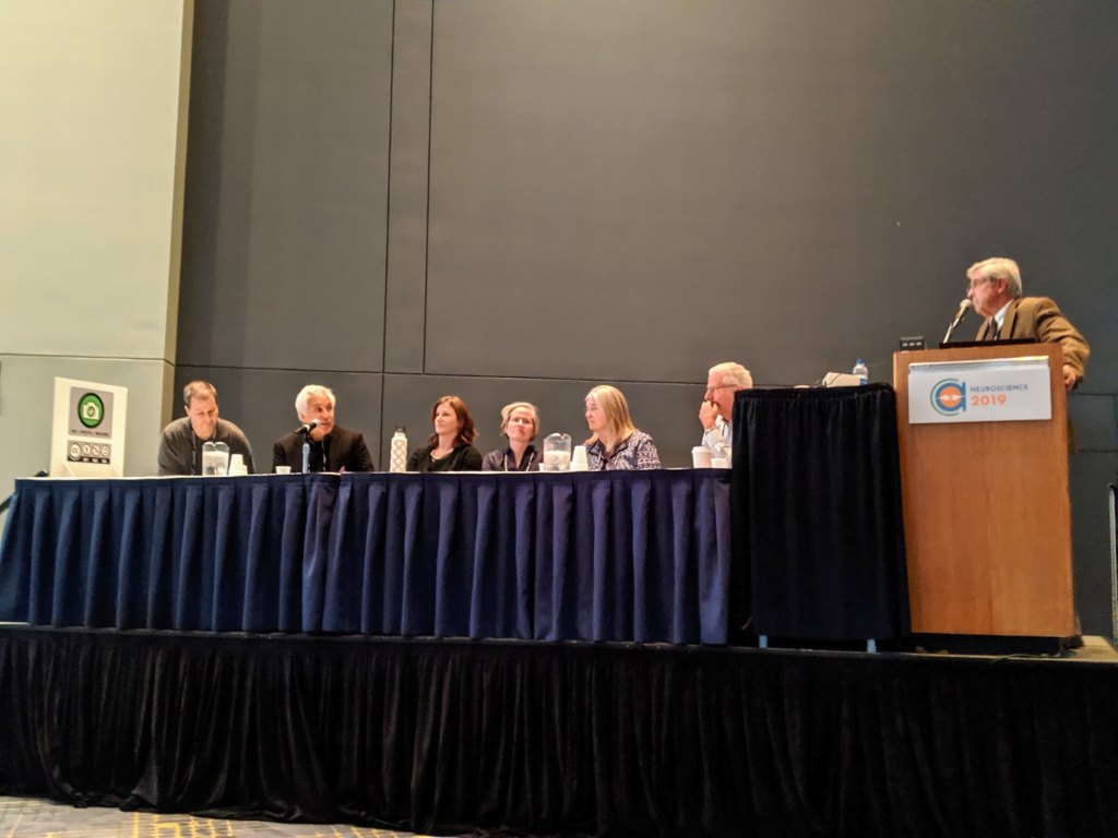 Image of adult panelists sitting at table