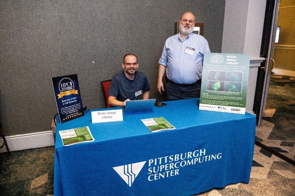 Dr. Alan Watson and Alexander Ropelewski at the Brain Image Library exhibitor table.