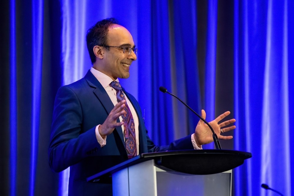 photo of Dr. Sheth at podium